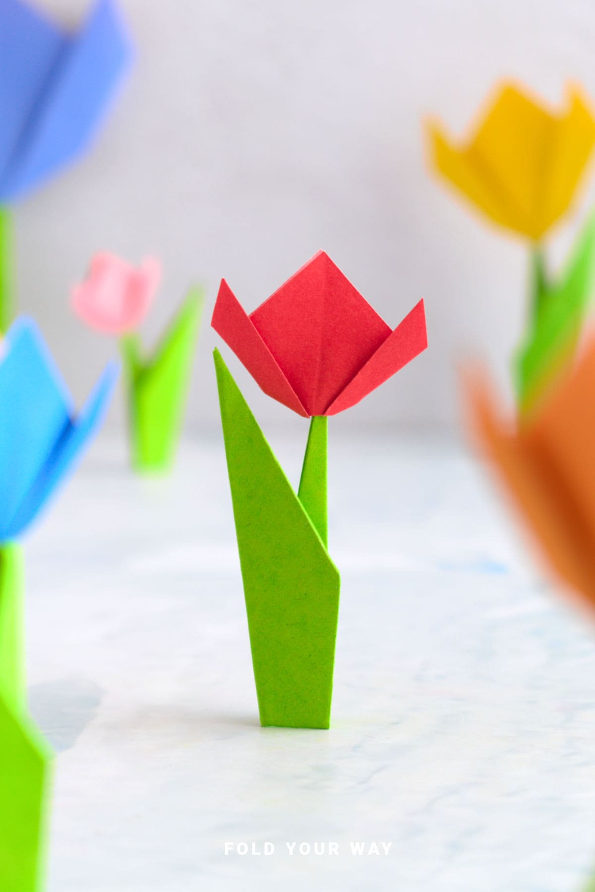Close up image of a red paper tulip.