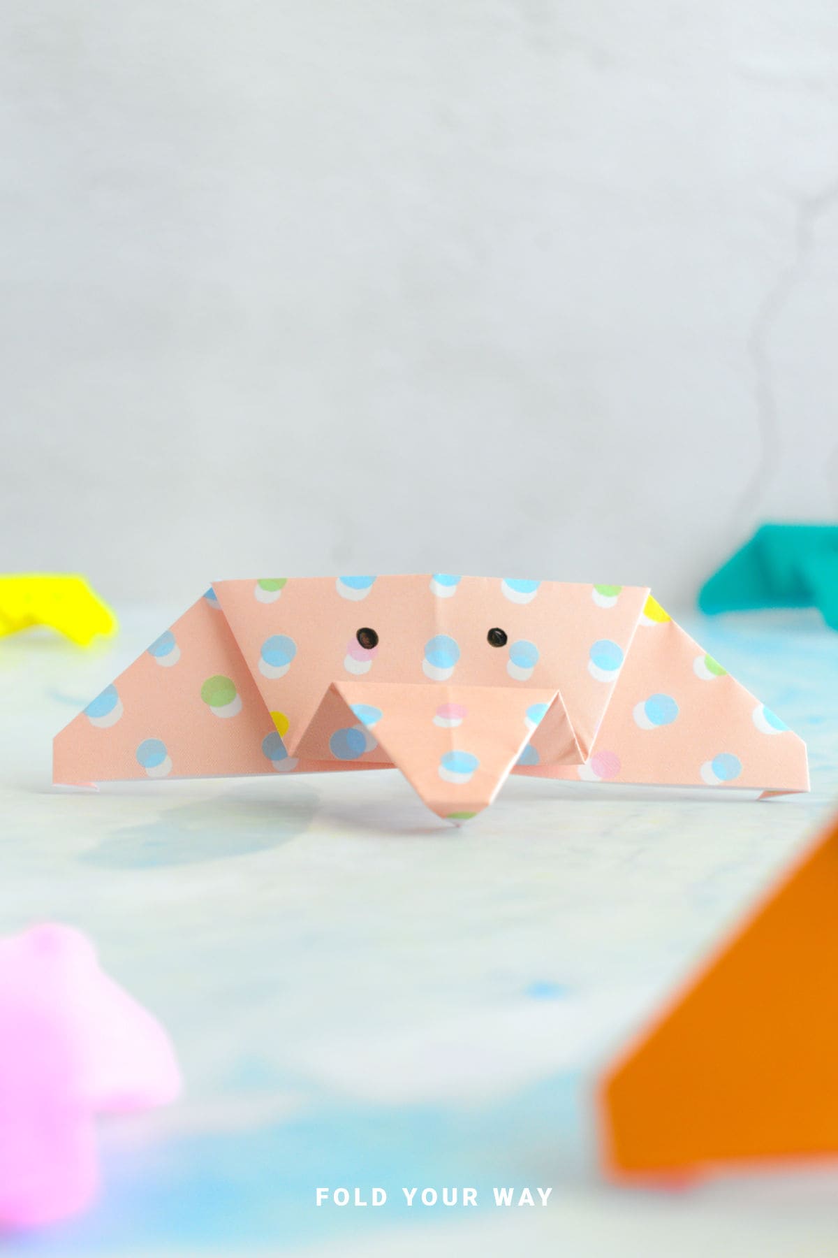 Close up image of an origami elephant face.