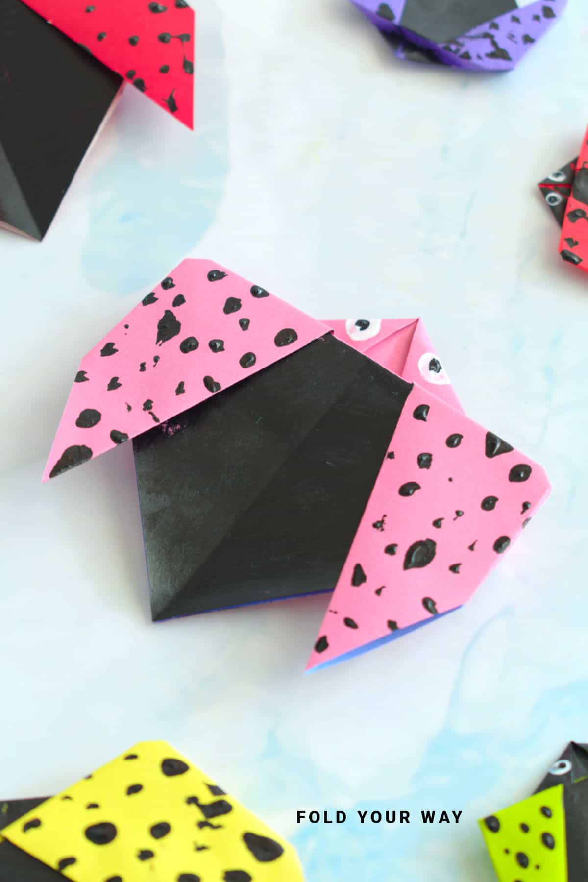 Pink origami ladybird.