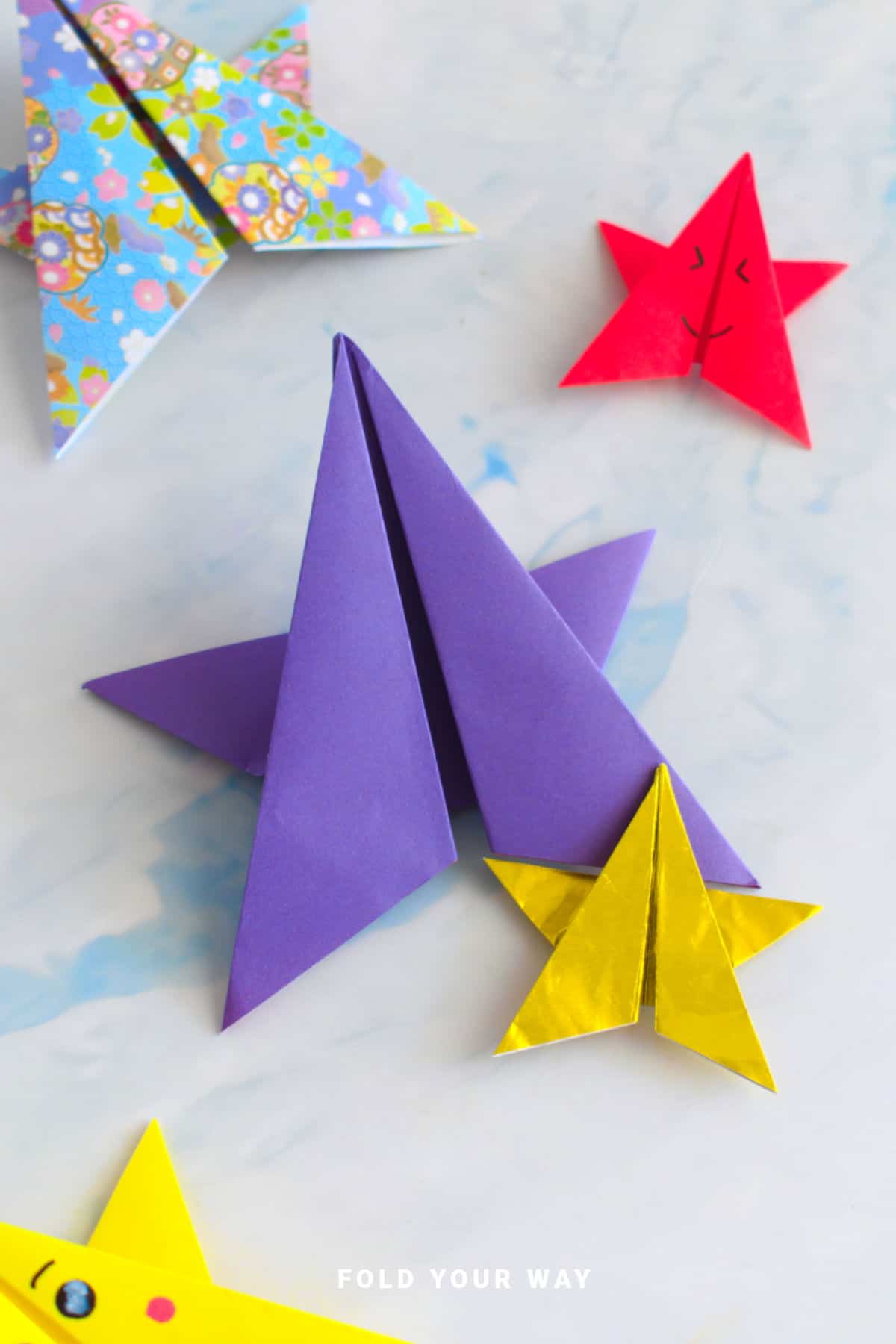 Purple and gold origami stars.