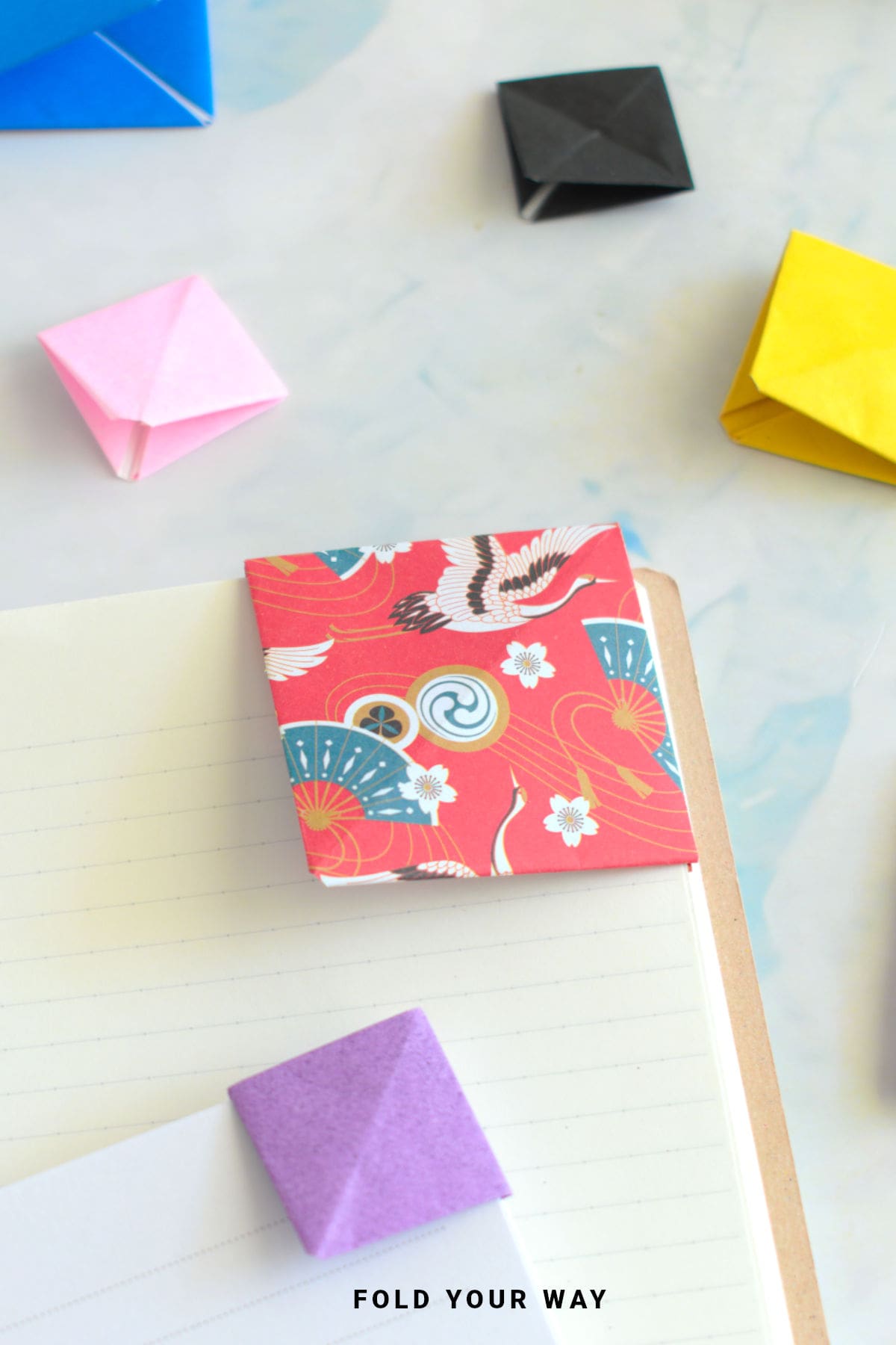 Red and white corner origami bookmark.
