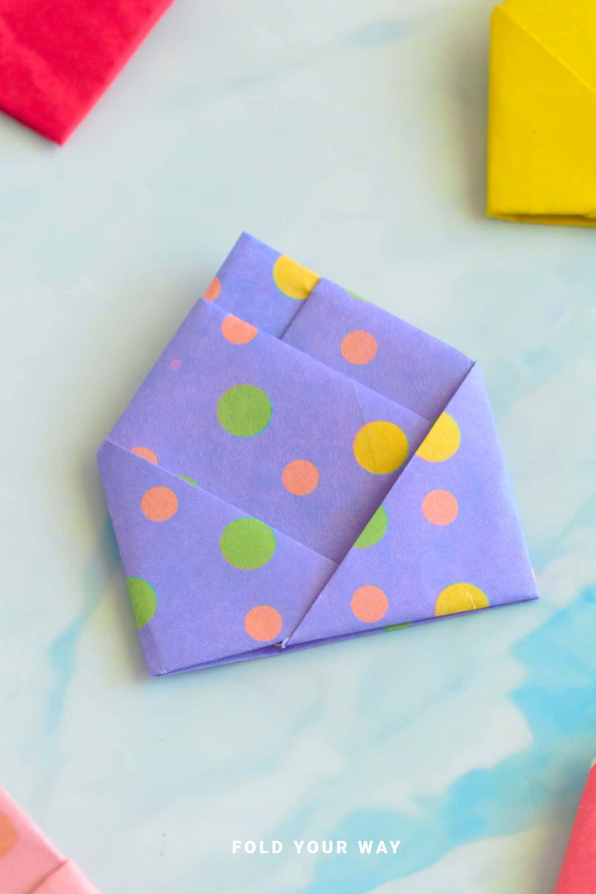 Purple origami letterfold.