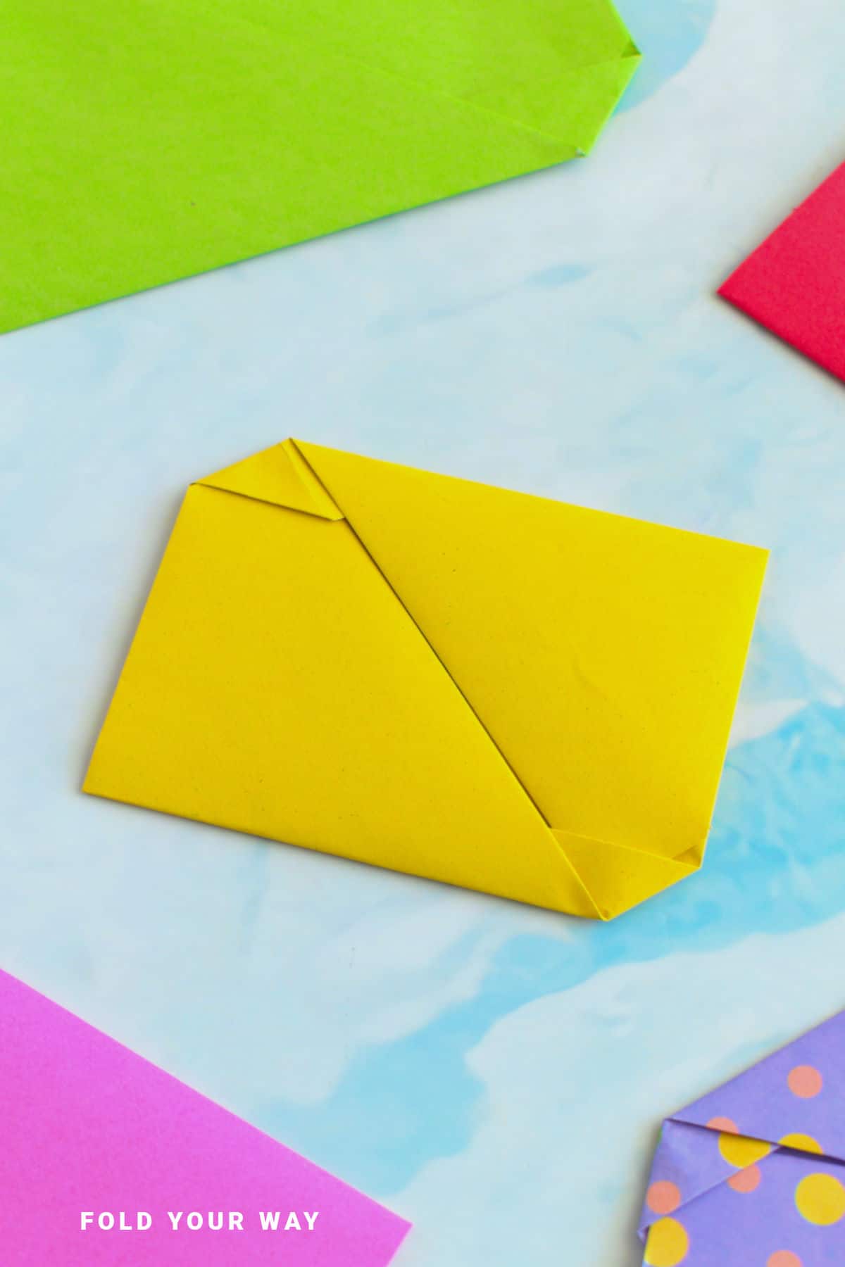 Yellow origami envelope letterfold.