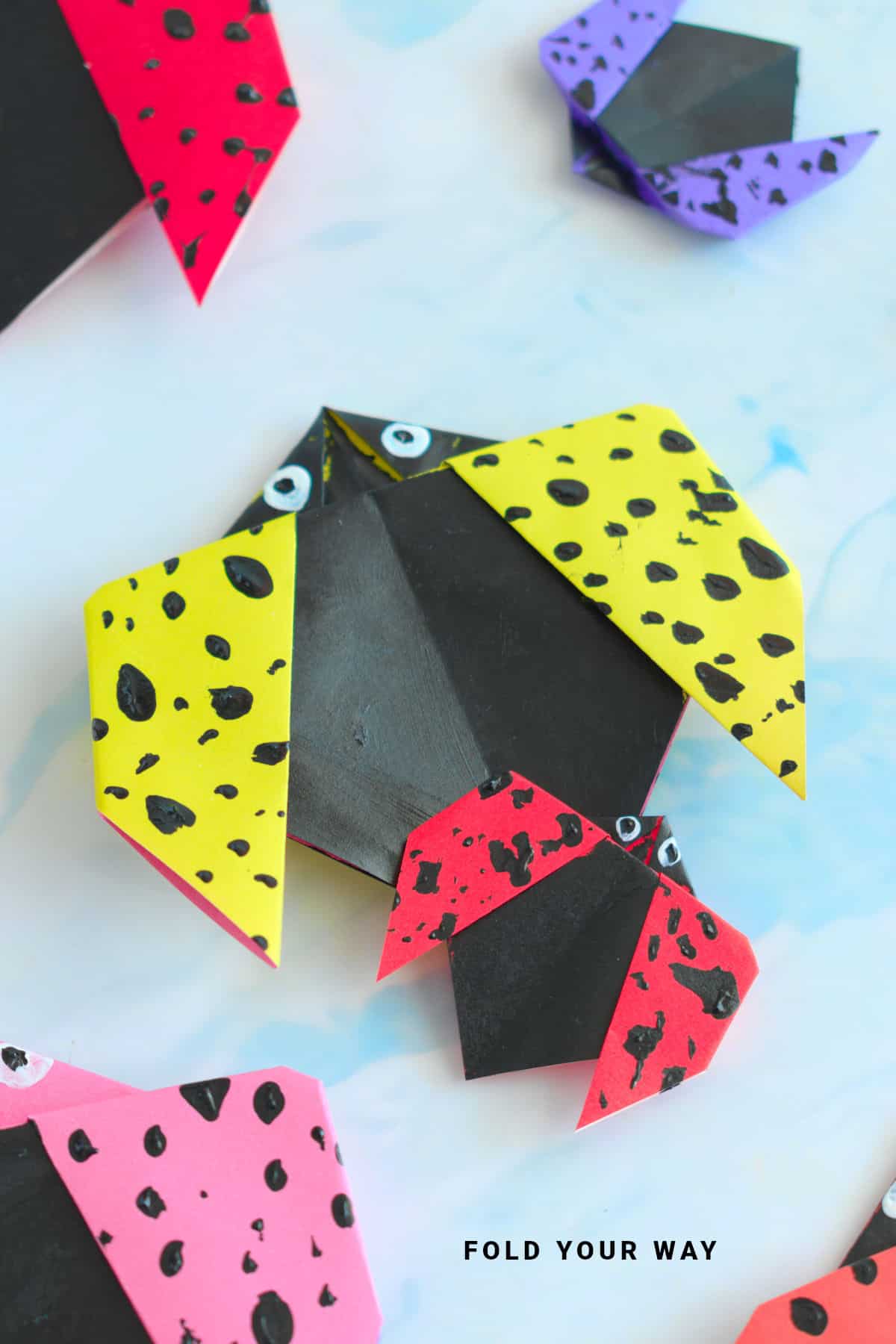 Yellow and red origami ladybirds.