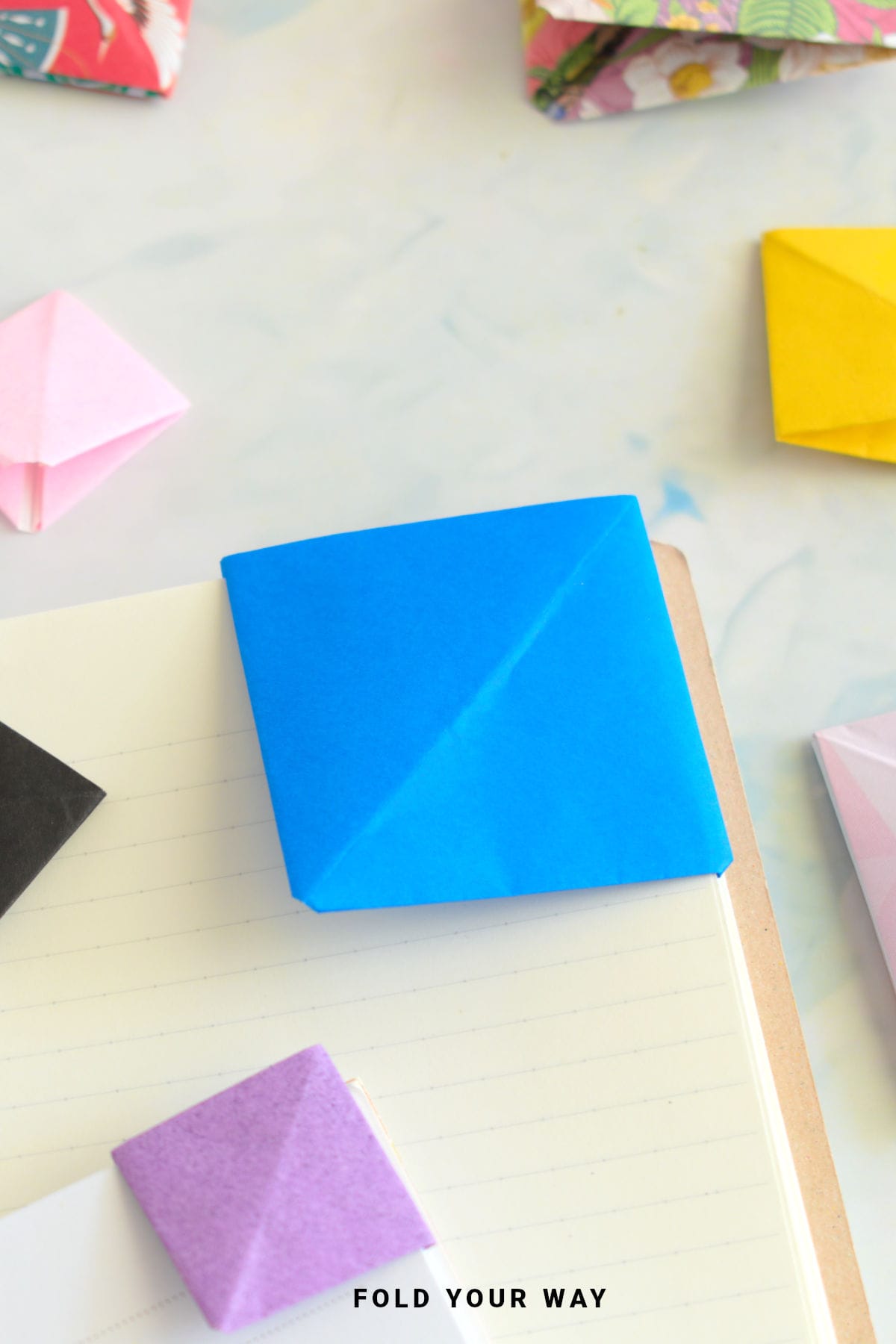 Blue origami corner bookmark.