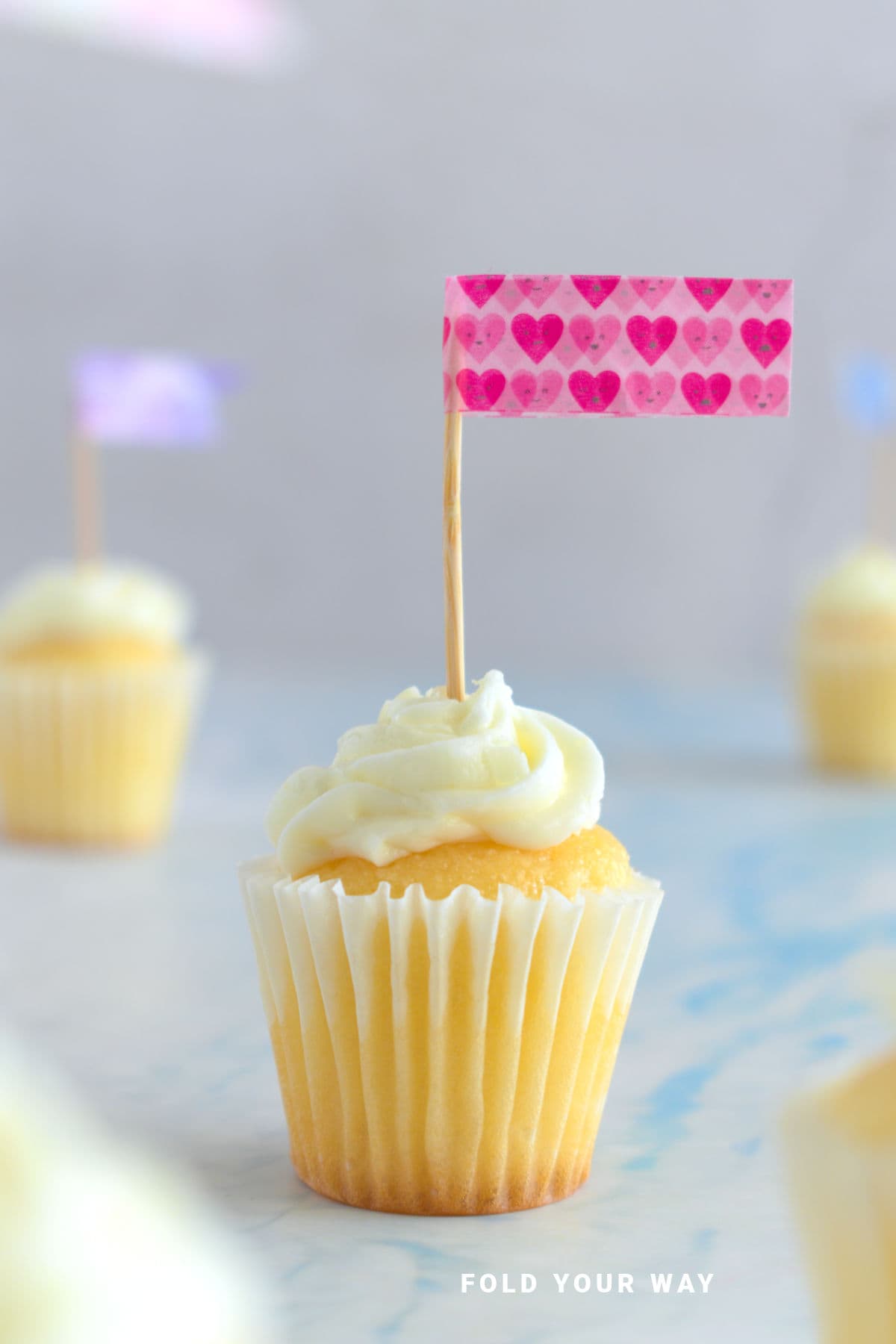 Washi tape cake topper on a cupcake.