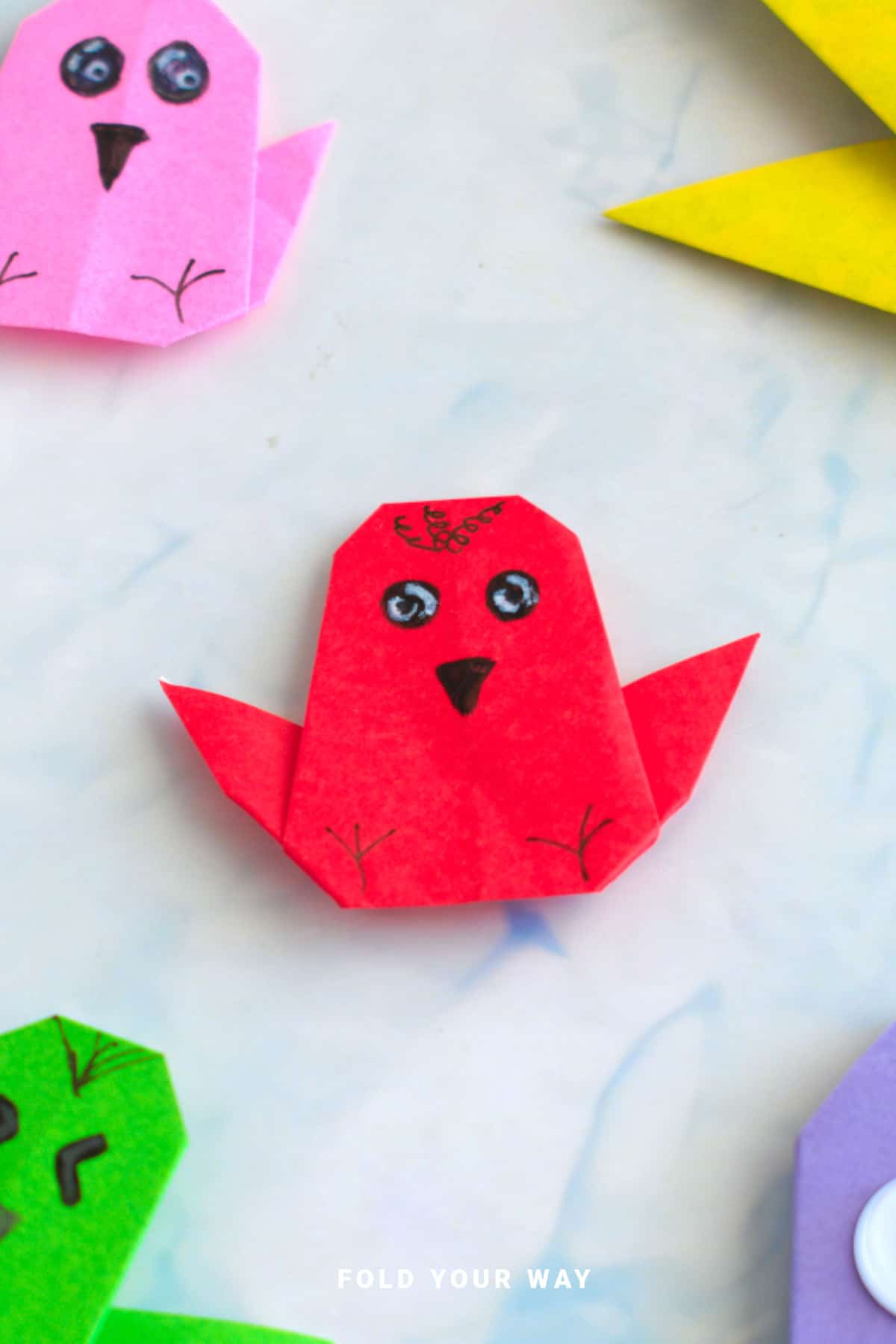 Red origami chicken.