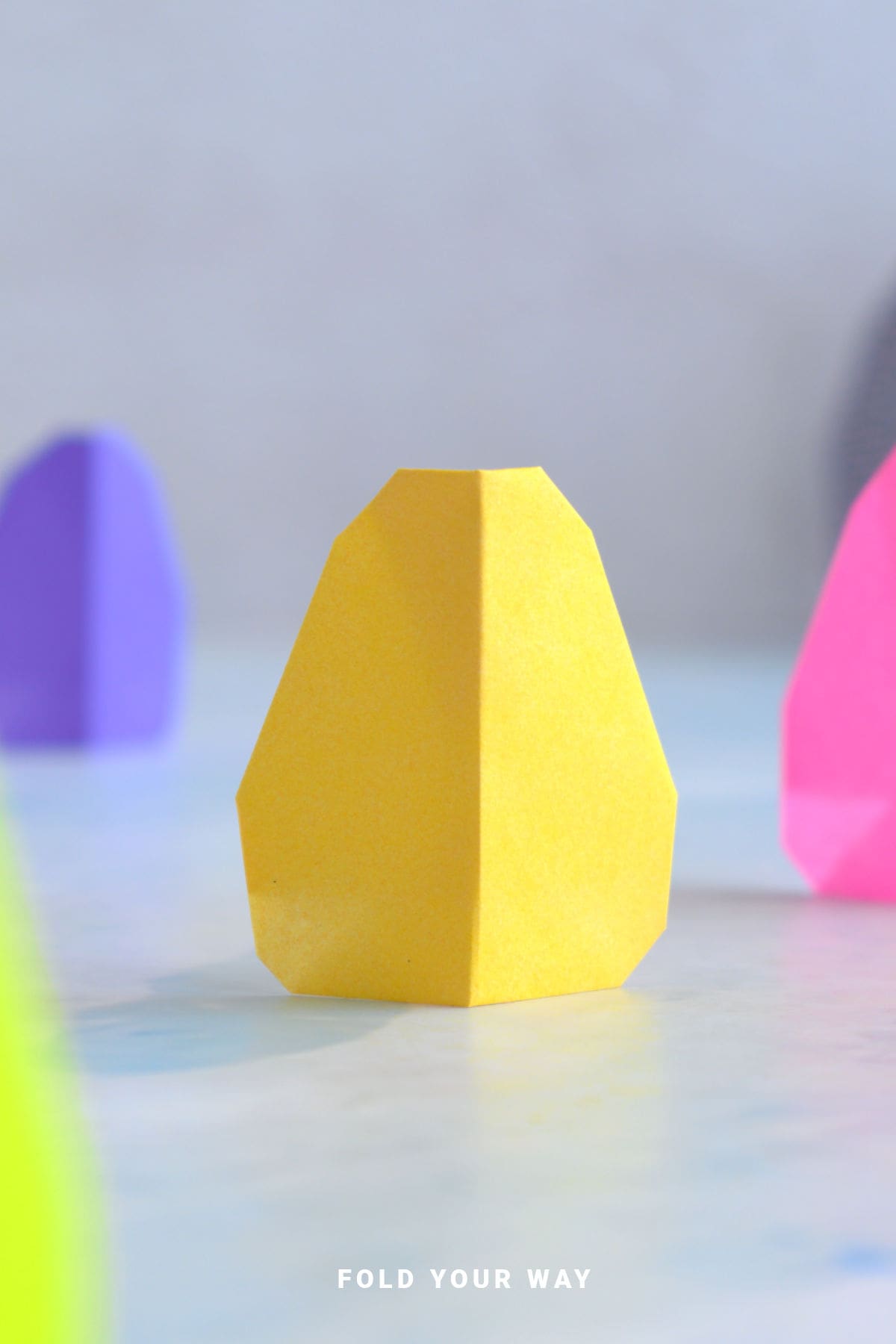 Yellow origami egg.