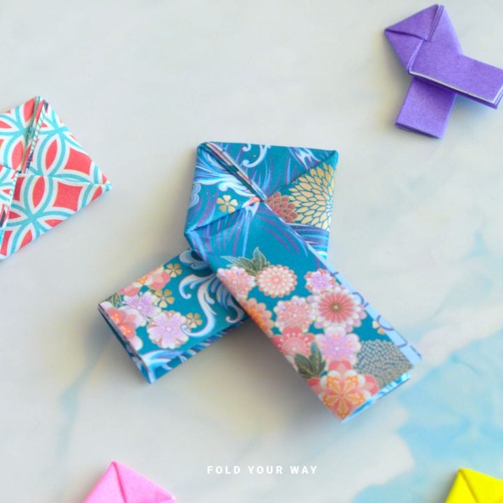 Close up image of an origami lovers knot.