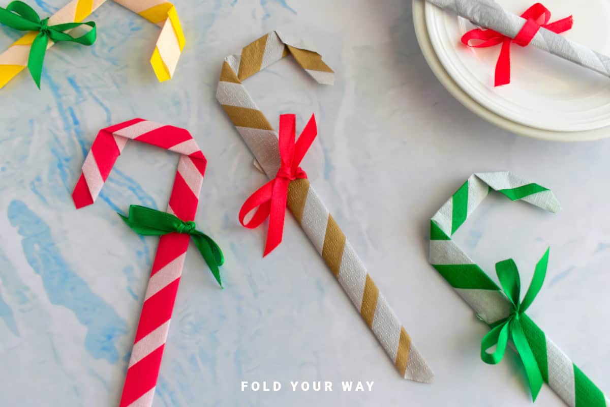 Close up image of candy cane napkin folds.