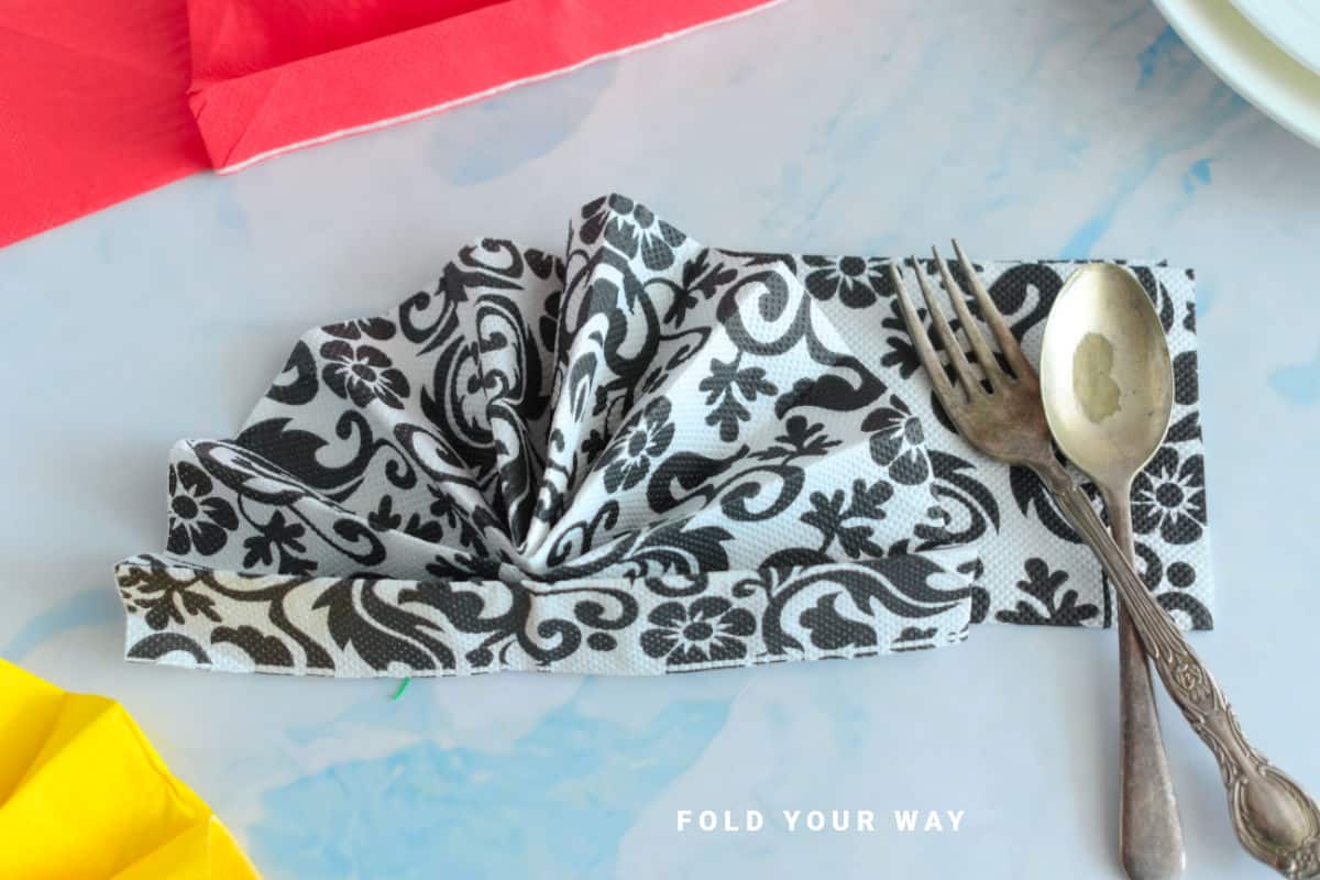 Close up image of a black and white folded napkin.