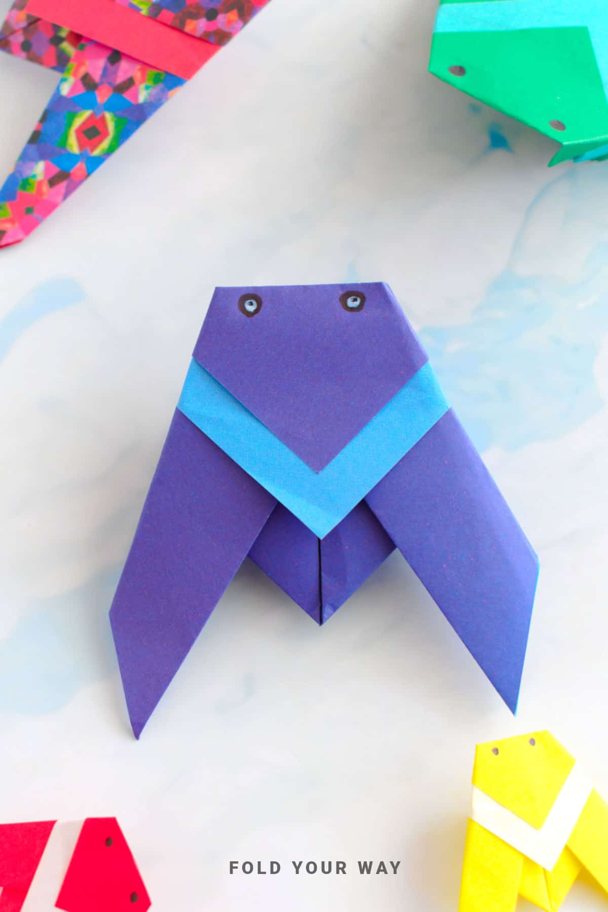 Purple and blue origami cicada.