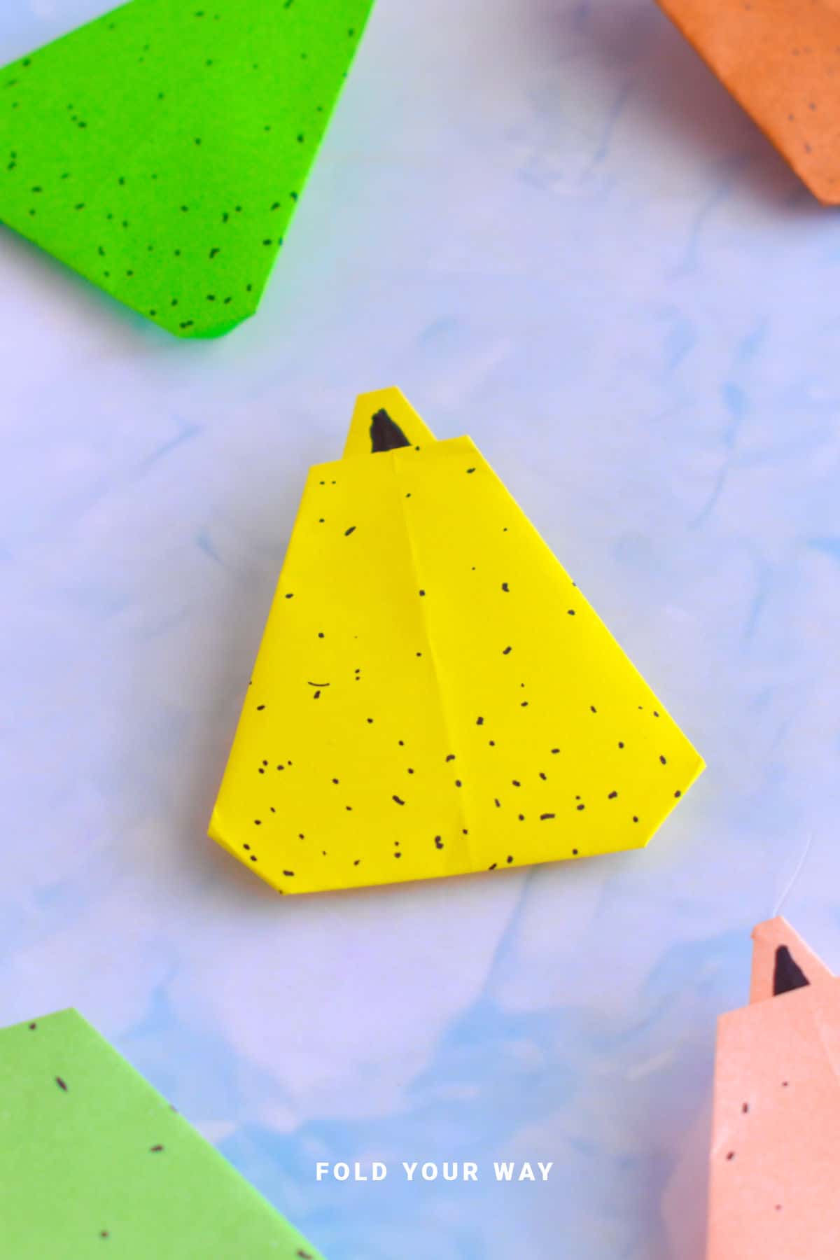 Yellow origami pear.