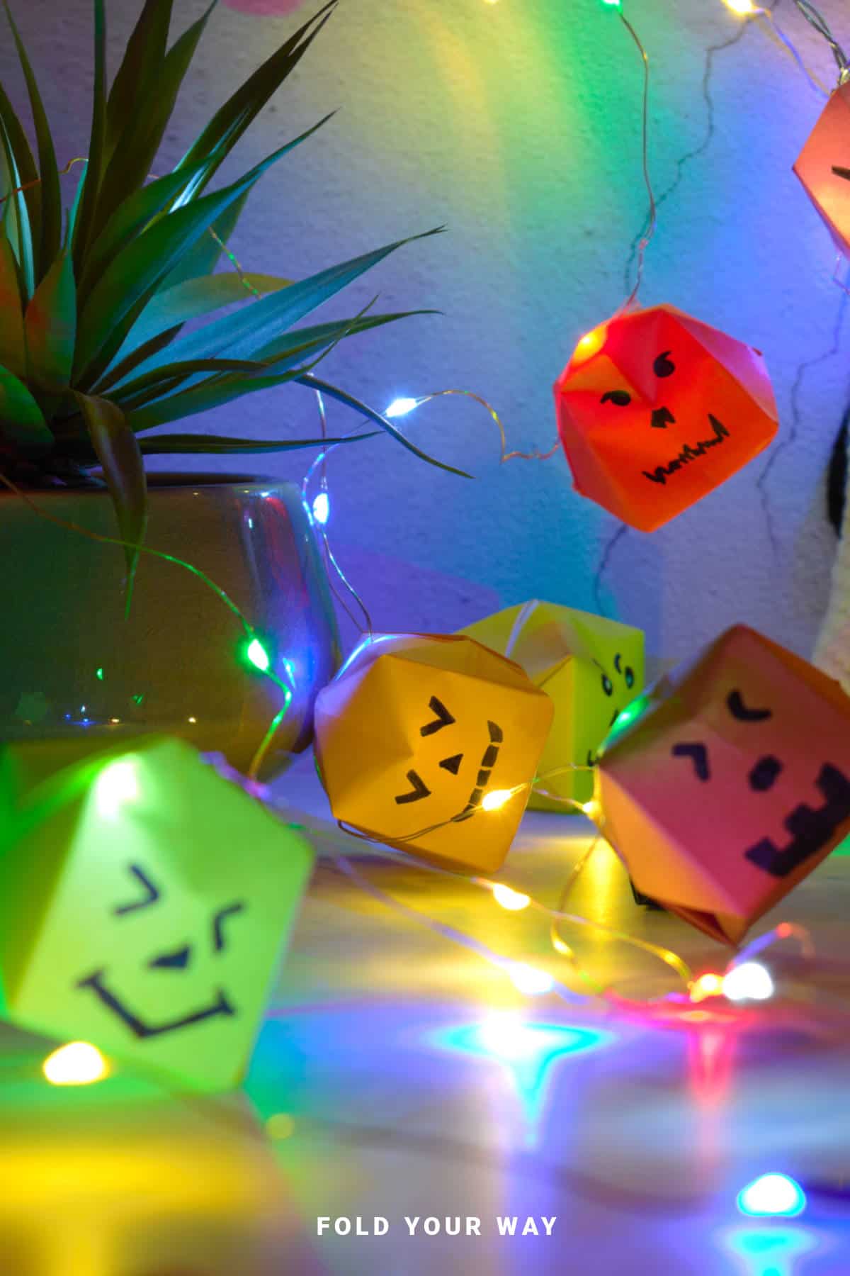 Close up image of origami pumpkin garland.