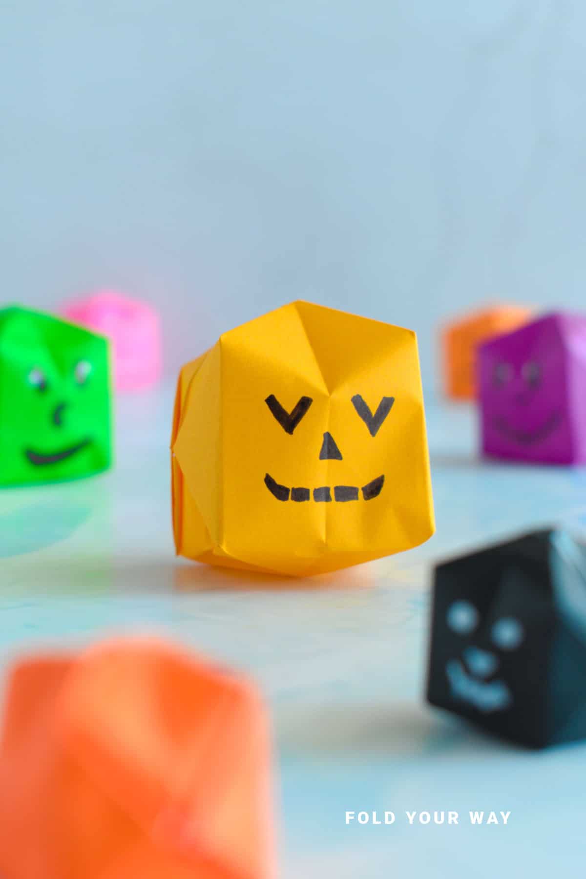 Orange origami pumpkin.