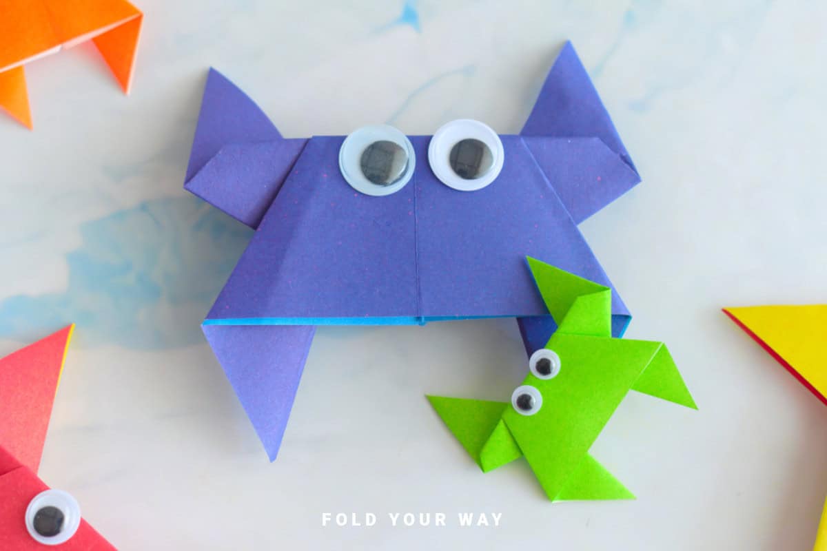 Purple and green origami crabs.