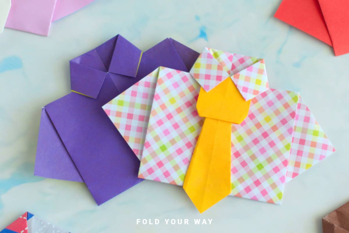 Close up image of origami shirts.