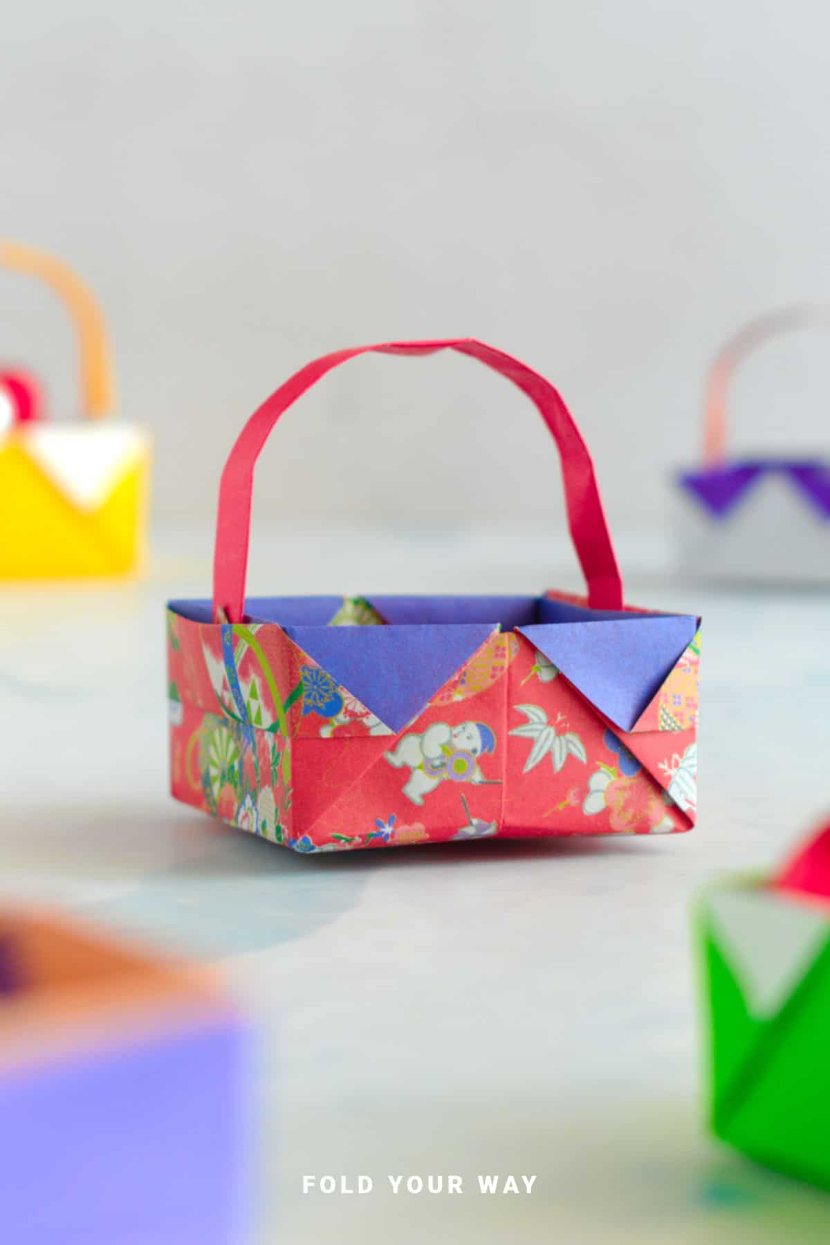 Purple and red origami basket.