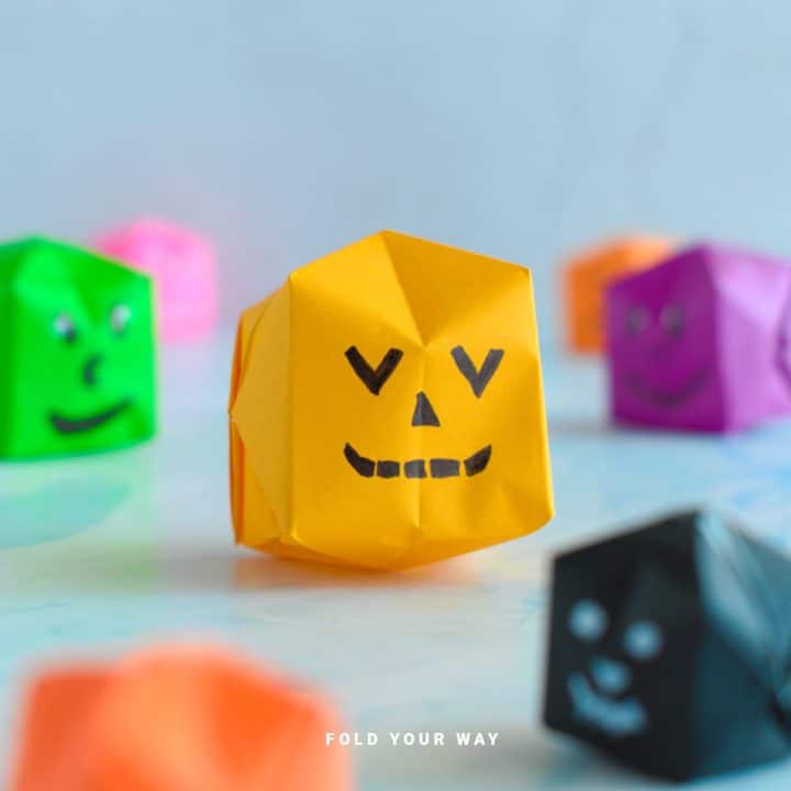 Close up image of an origami pumpkin.