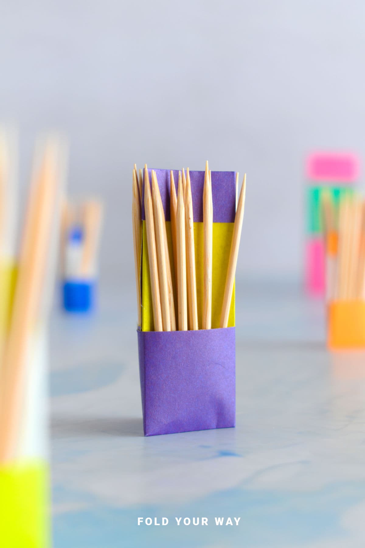 Purple origami toothpick holder.