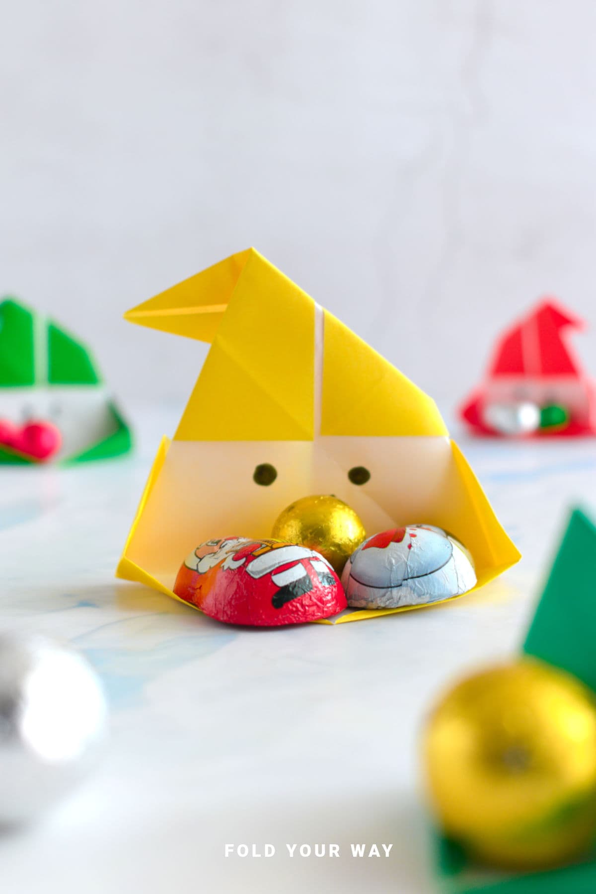Yellow origami Santa box.