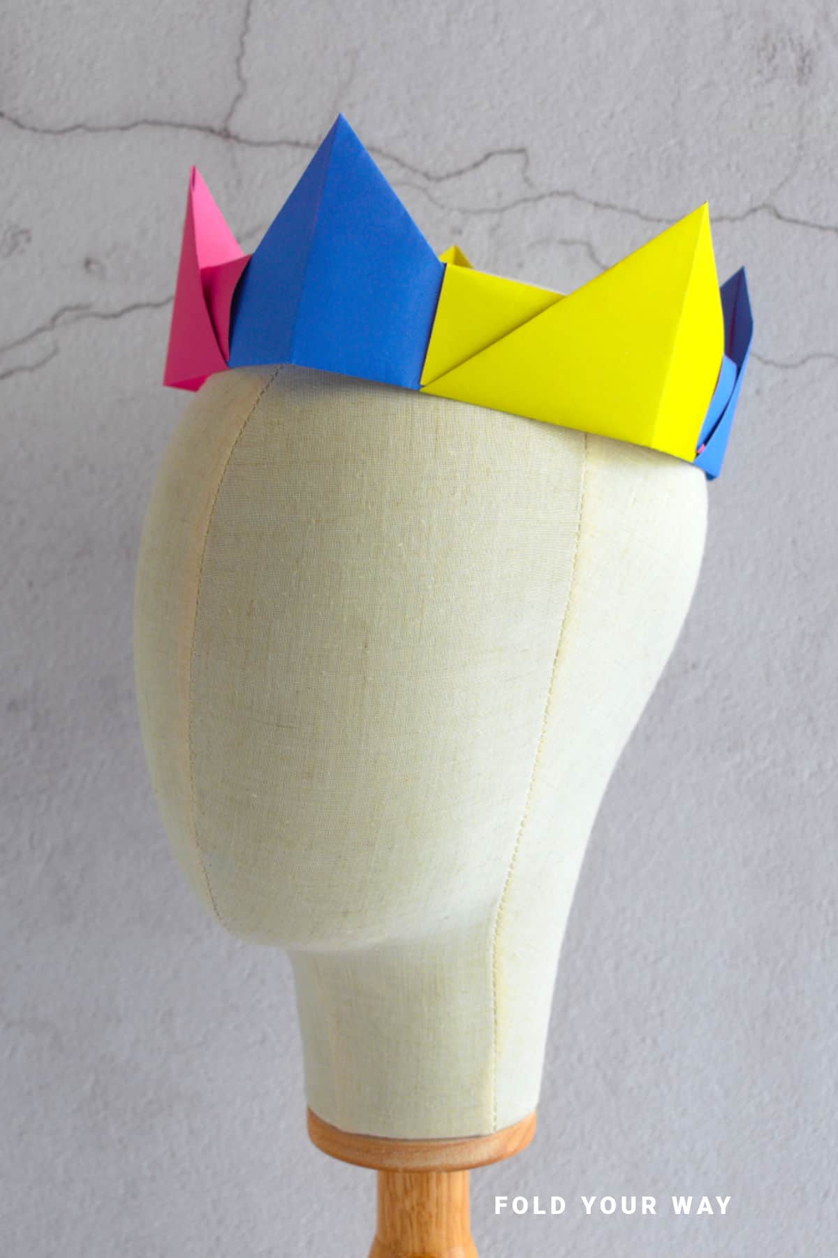 Paper crown on a mannequin.