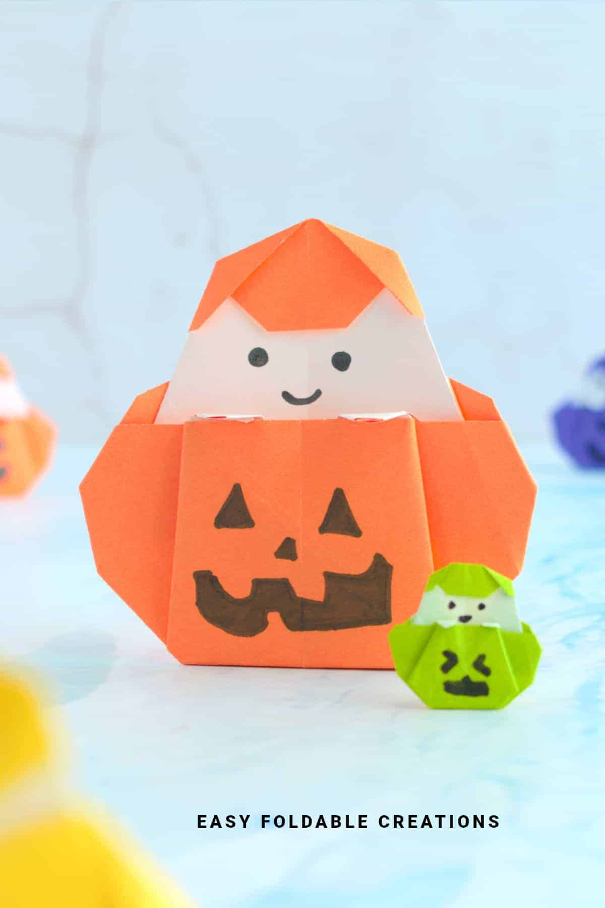 Origami ghost in pumpkin.