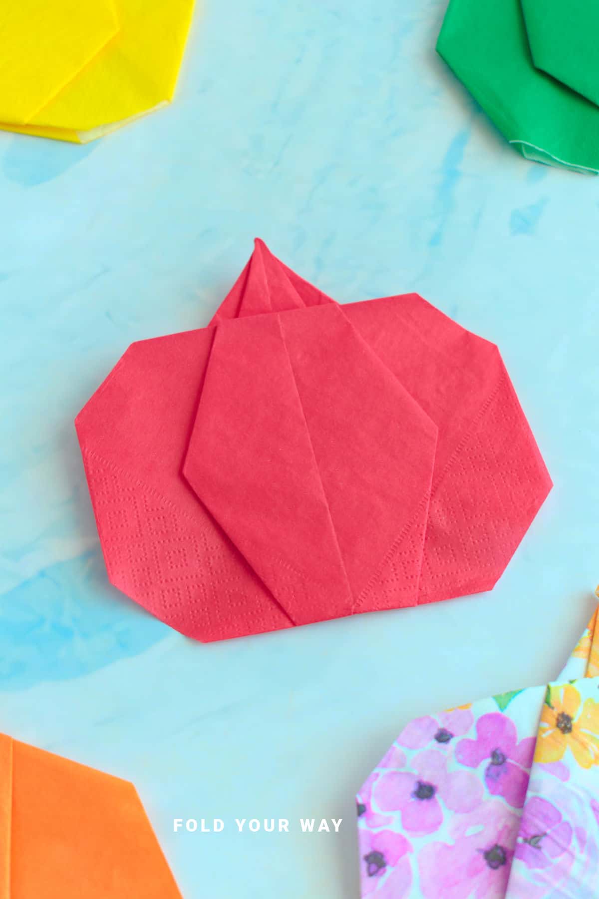 Red pumpkin napkin fold.
