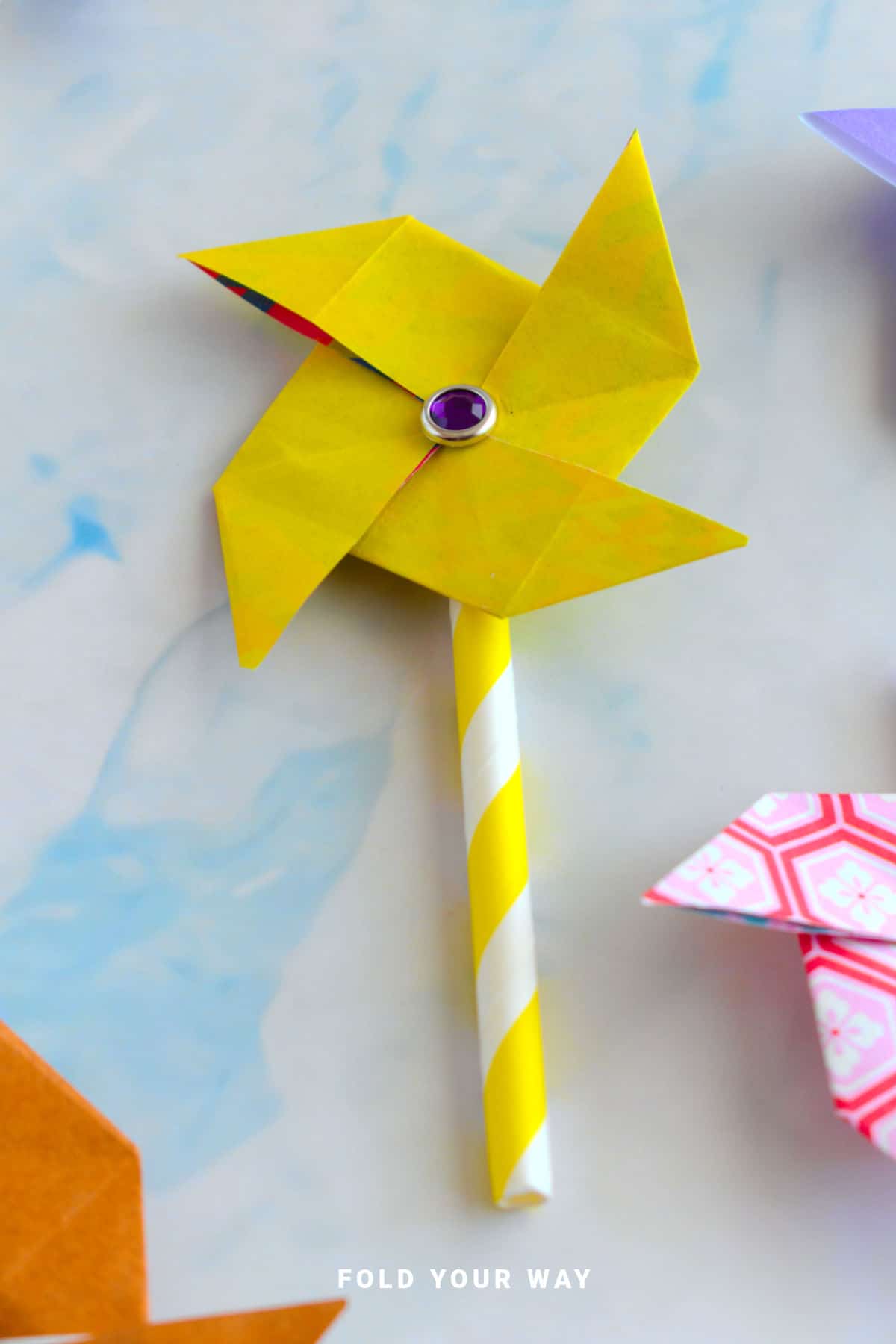 Yellow origami pinwheel.