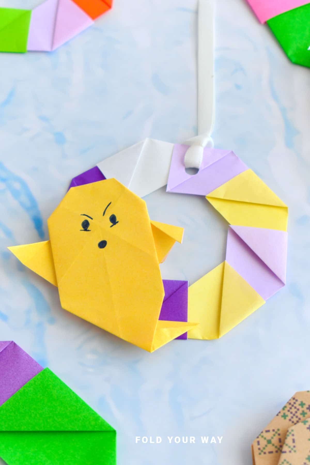 Close up image of an origami wreath.