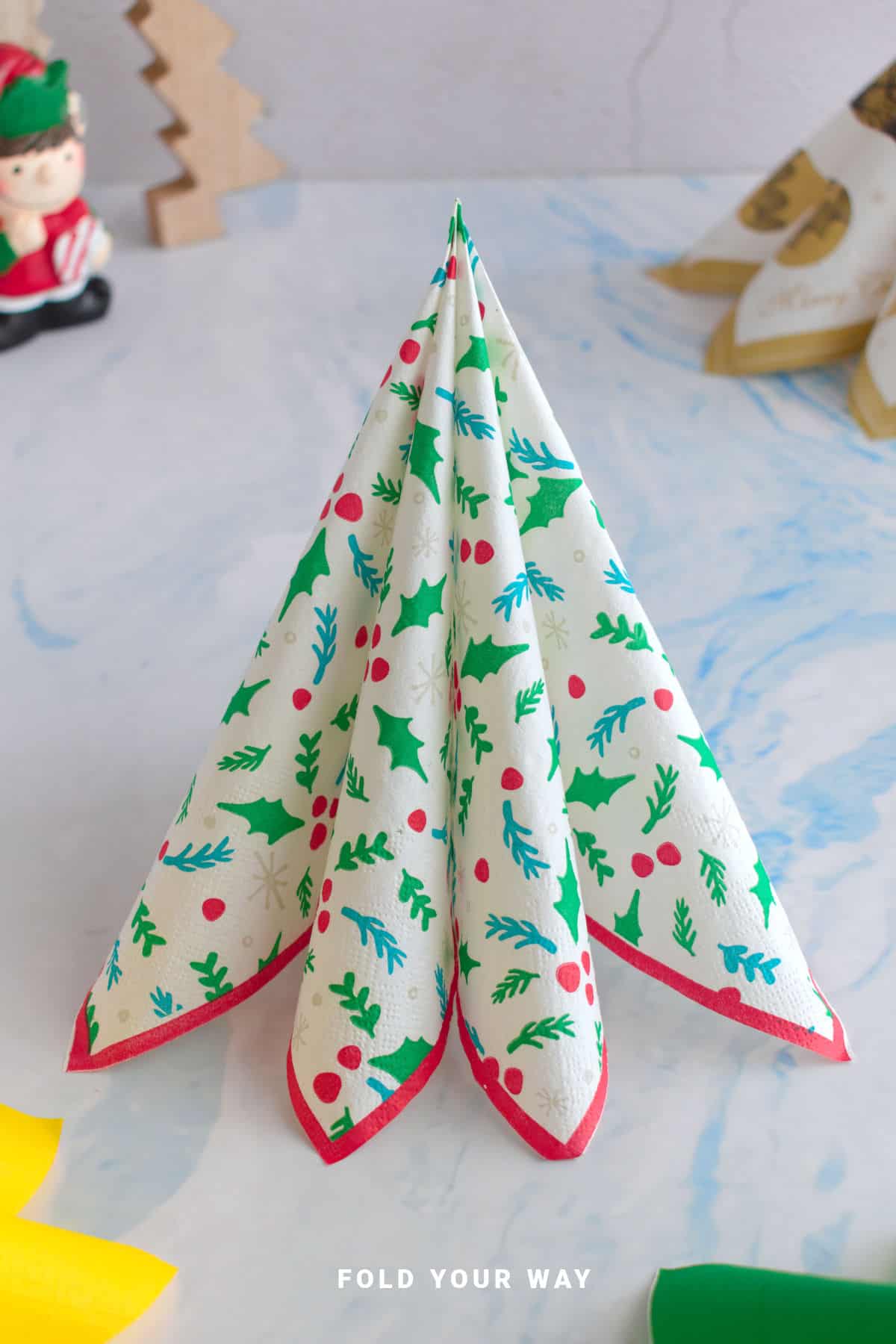Standing Christmas tree napkin fold.
