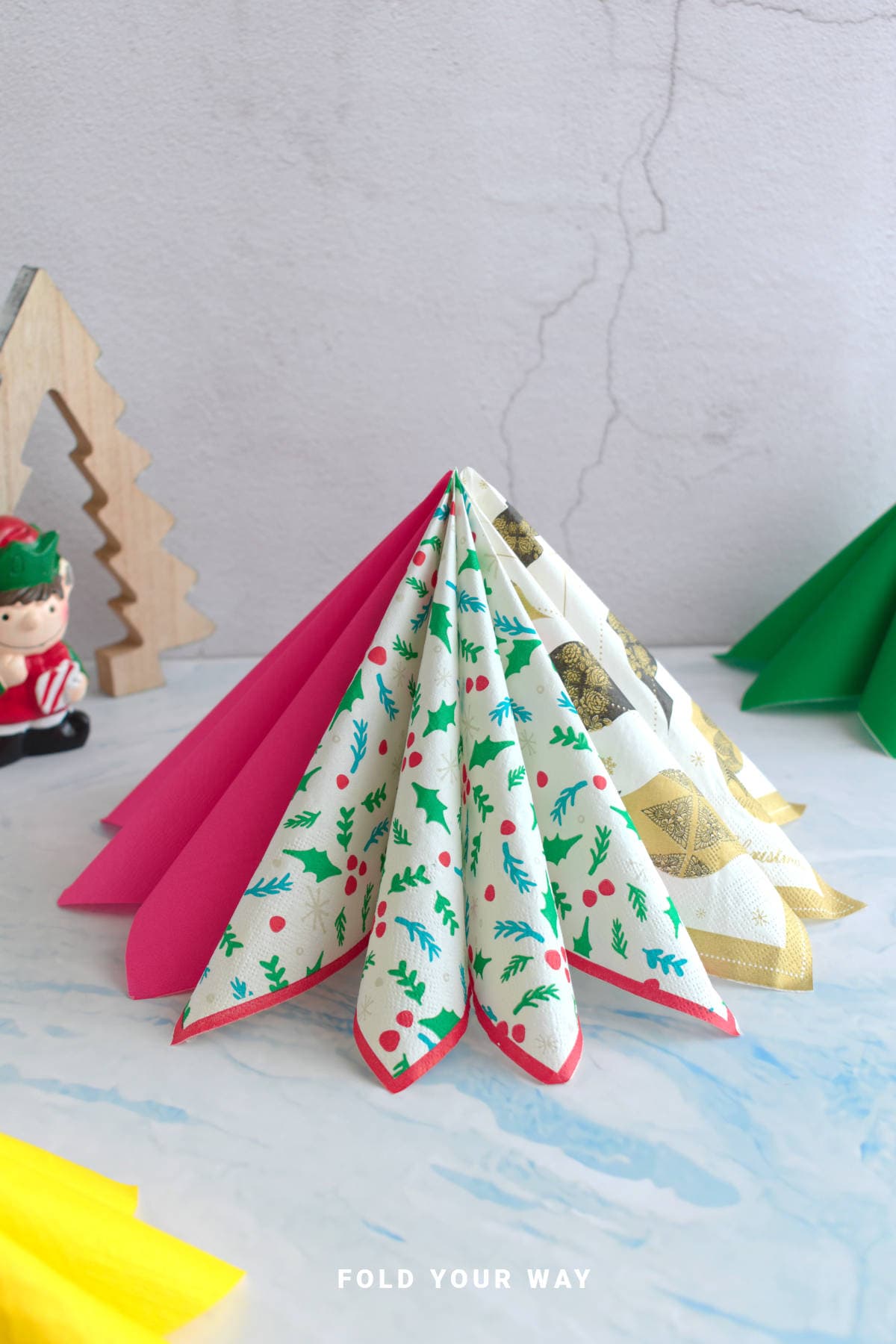 Christmas tree napkin folds.