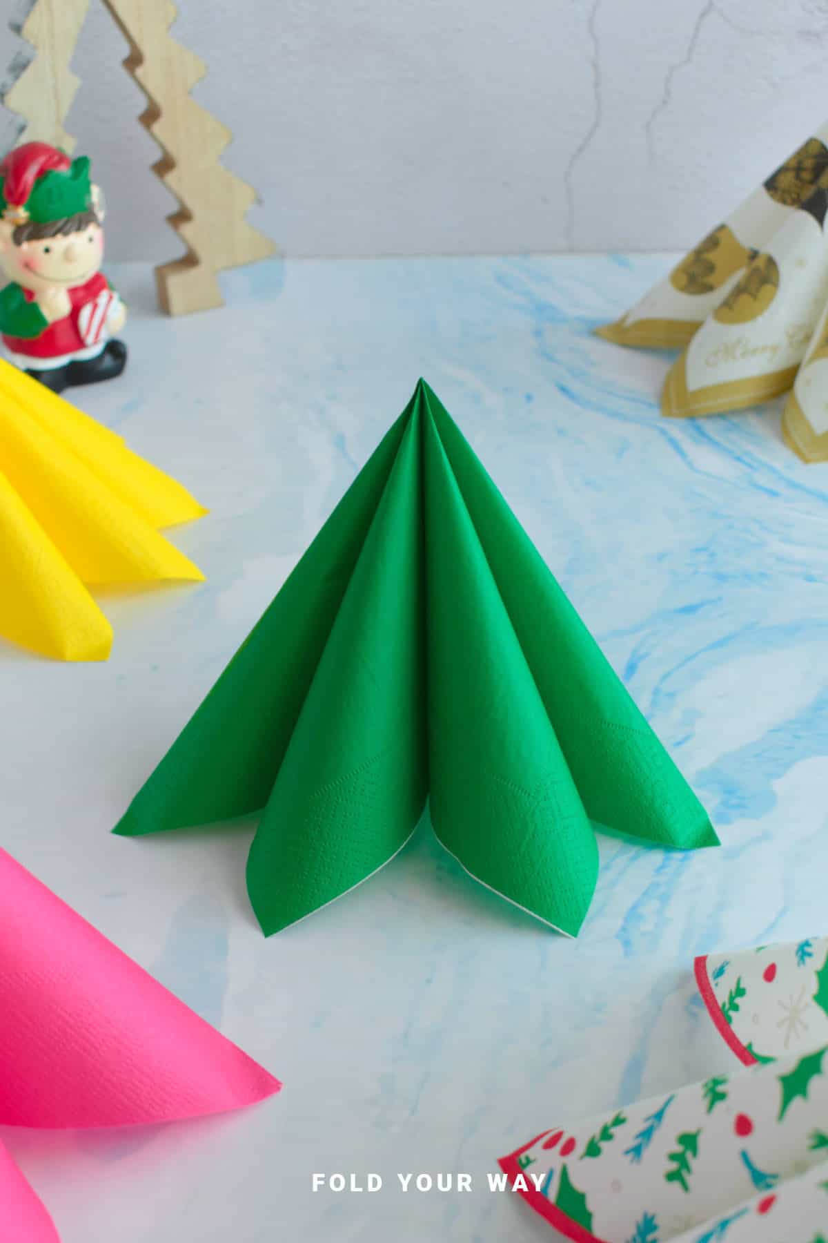 Green Christmas tree napkins fold.