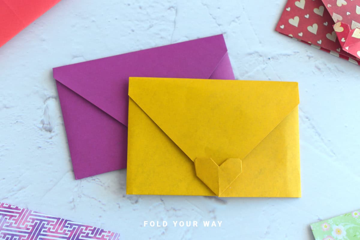 Close up image of origami heart envelopes with heart closures.